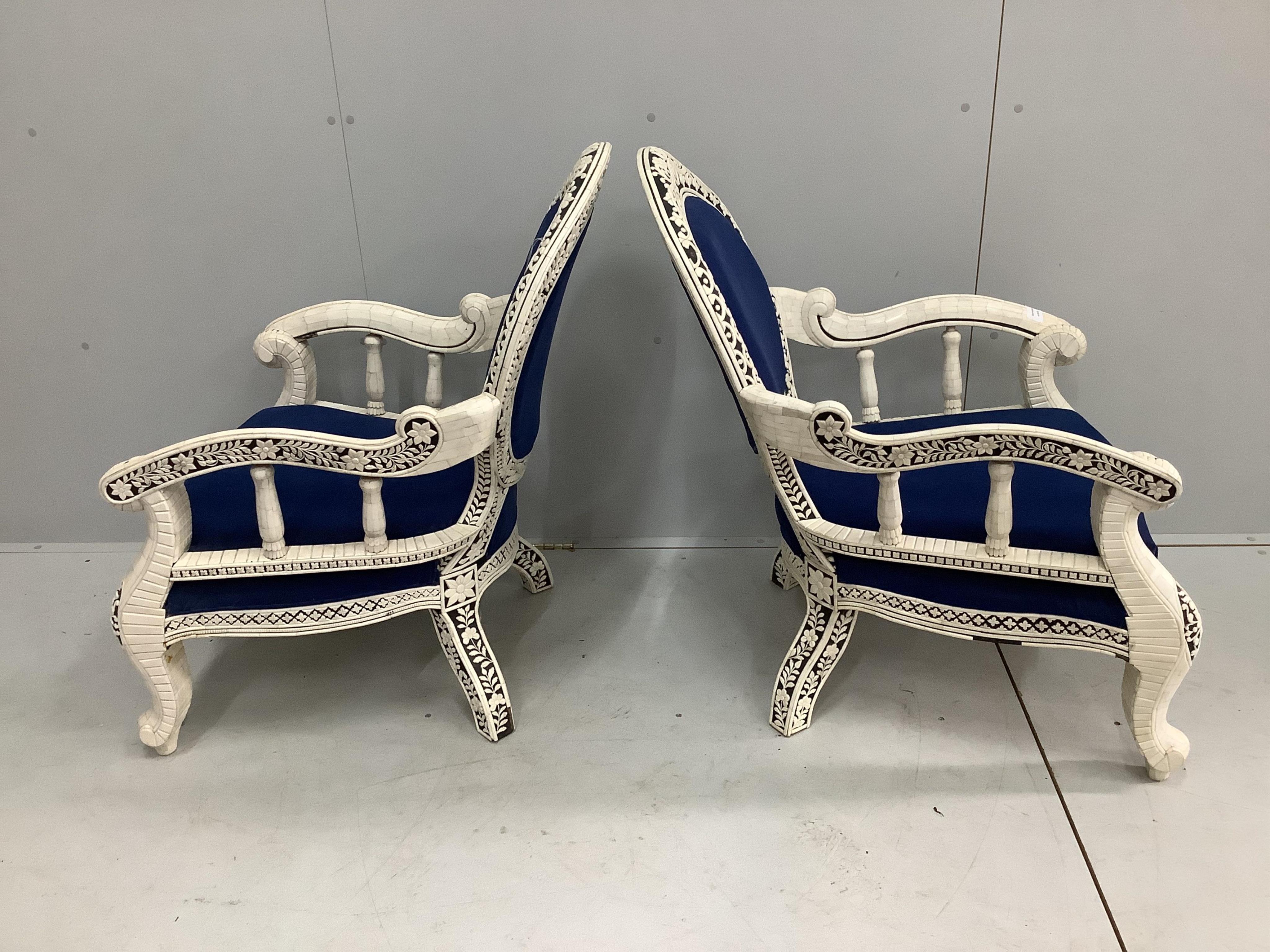 A pair of Indian bone veneered armchairs, width 67cm, depth 56cm, height 93cm. Condition - fair